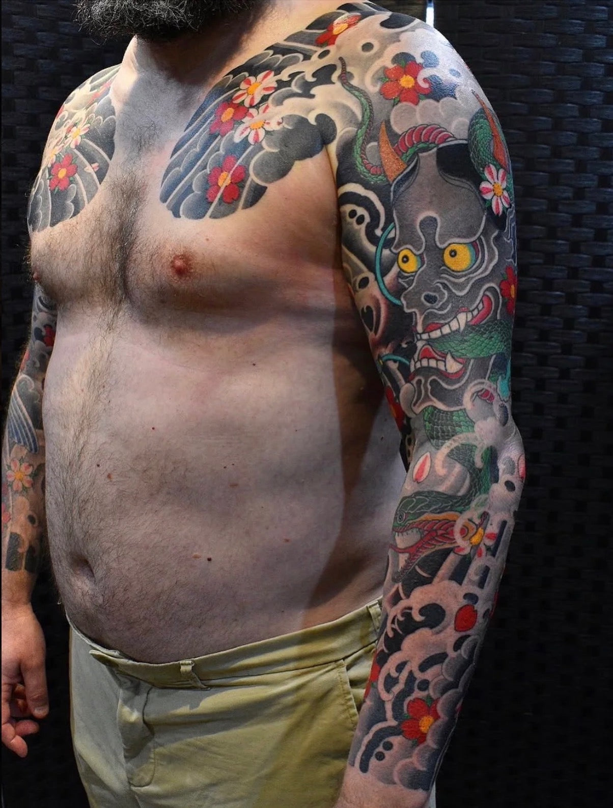 Traditional Japanese Hannya mask sleeve with snake, flowers and background