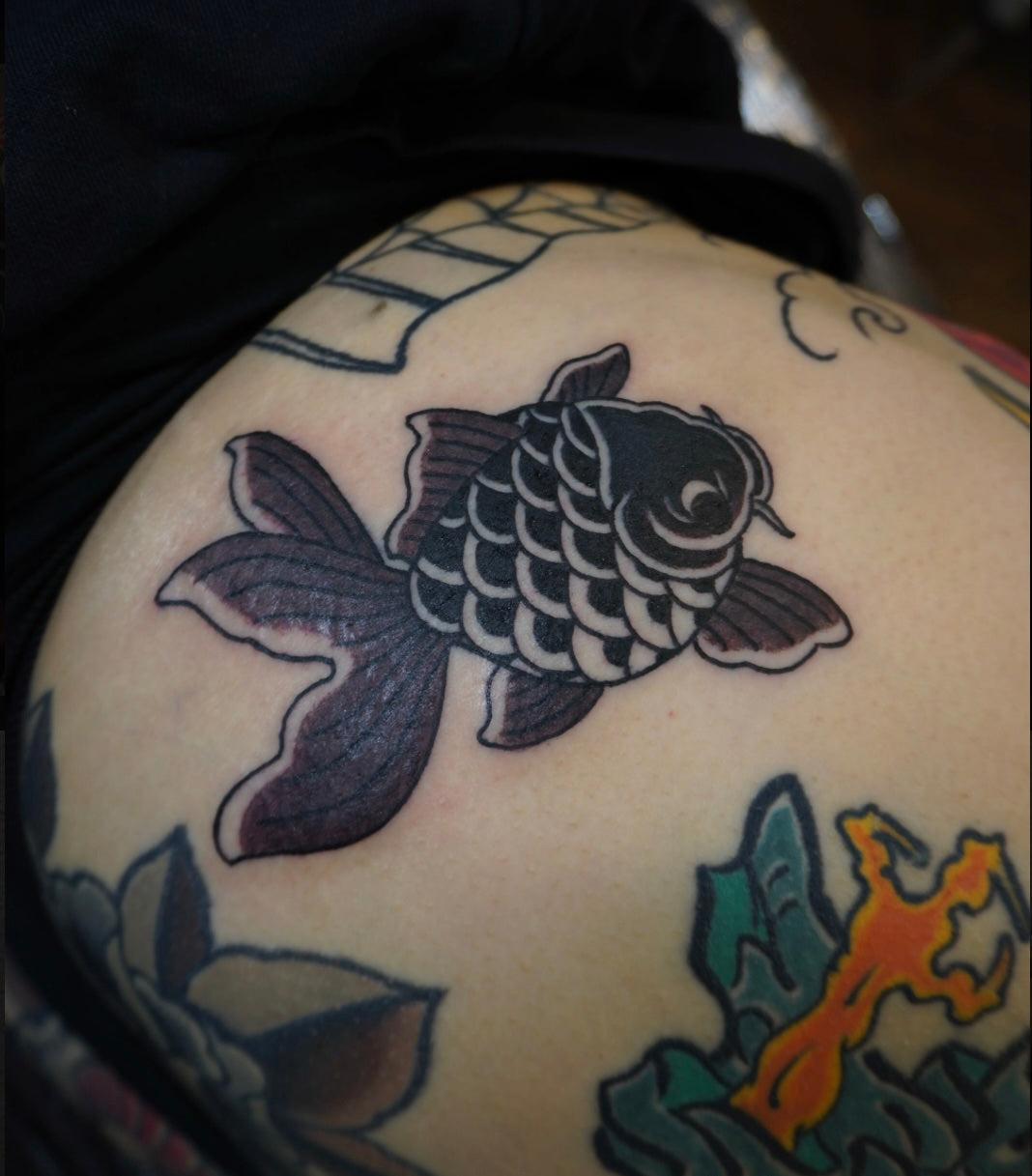 Traditional Japanese black koi tattoo